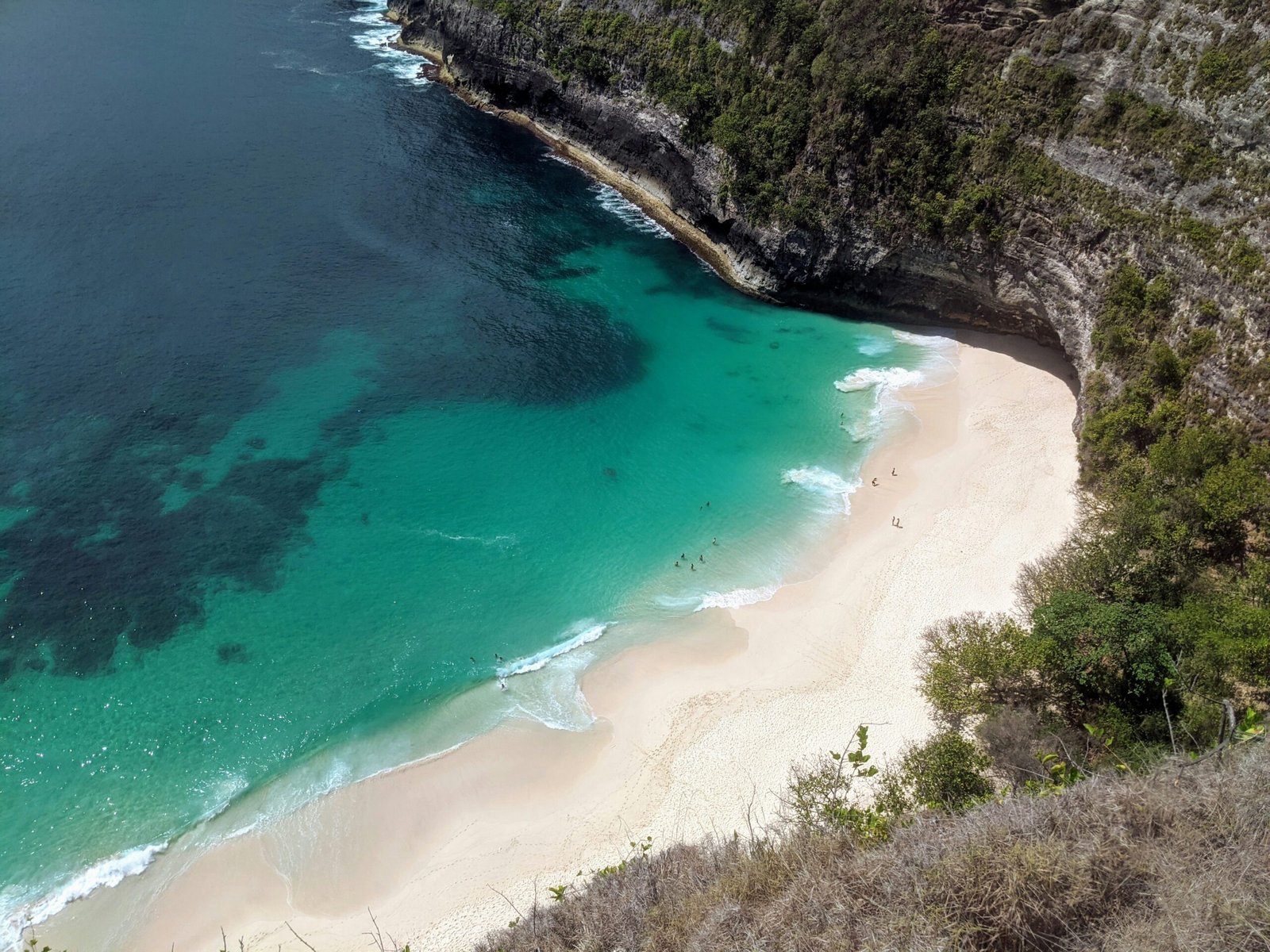 A quiet stretch of white sand and turquoise sea